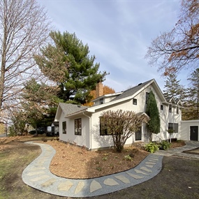 Flagstone stepping-stone pathway with crushed granite edging around the side yard